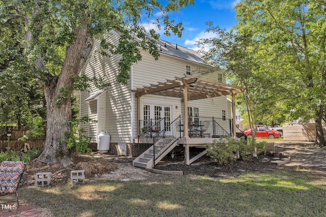 back of house with a pergola, a deck, french doors, and stairway