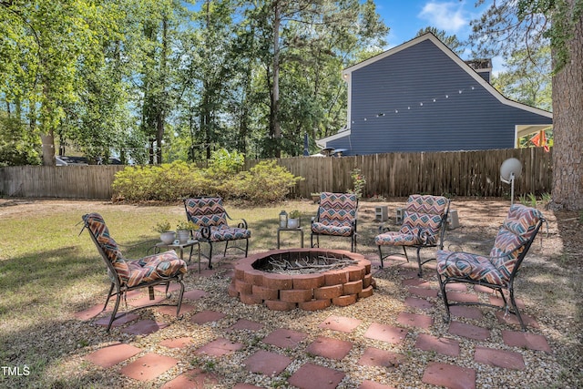 view of patio / terrace with an outdoor fire pit