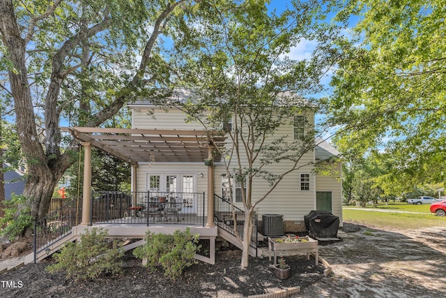 back of house with a wooden deck, central AC, french doors, and a pergola