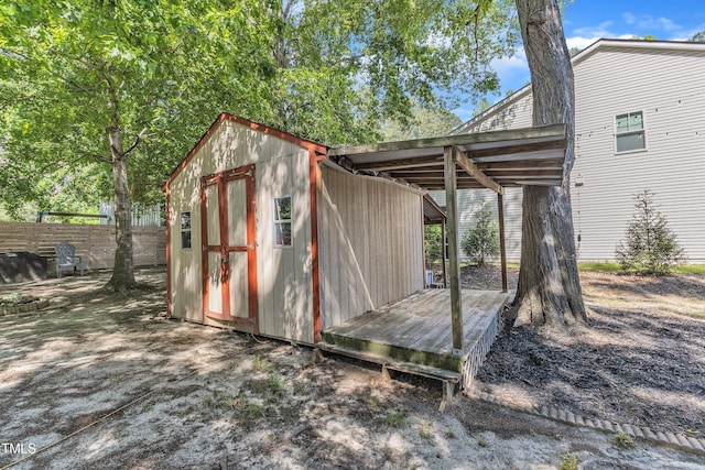 view of shed with fence