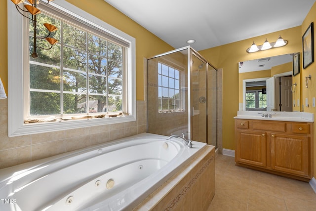1420 Norwood Crest Ct, Raleigh, NC 27614 - bathroom with a jetted tub, a stall shower, vanity, and tile patterned floors