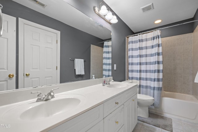 1420 Norwood Crest Ct, Raleigh, NC 27614 - full bath with double vanity, tile patterned floors, shower / tub combo with curtain, and toilet