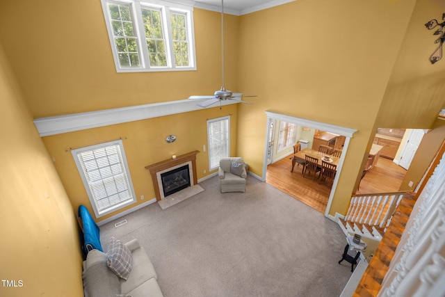 1420 Norwood Crest Ct, Raleigh, NC 27614 - carpeted living room with a high ceiling, healthy amount of natural light, a fireplace with flush hearth, baseboards, and ceiling fan