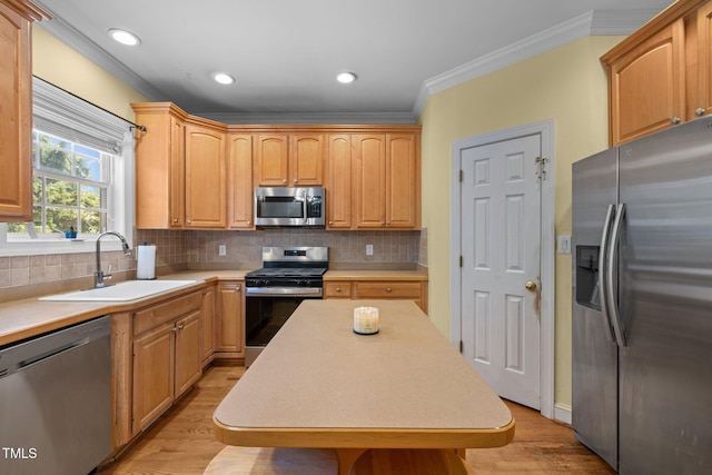 1420 Norwood Crest Ct, Raleigh, NC 27614 - kitchen featuring stainless steel appliances, a sink, crown molding, light wood-style flooring, and light countertops