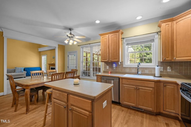 1420 Norwood Crest Ct, Raleigh, NC 27614 - kitchen featuring a sink, dishwasher, a center island, light wood finished floors, and decorative backsplash