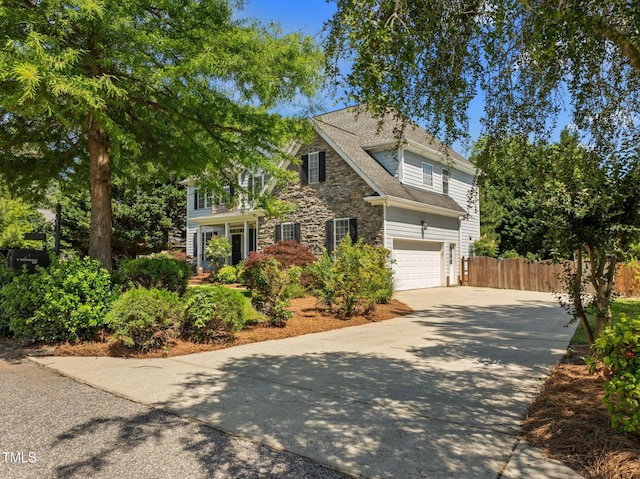 1420 Norwood Crest Ct, Raleigh, NC 27614 - traditional-style home featuring concrete driveway, stone siding, a garage, and roof with shingles