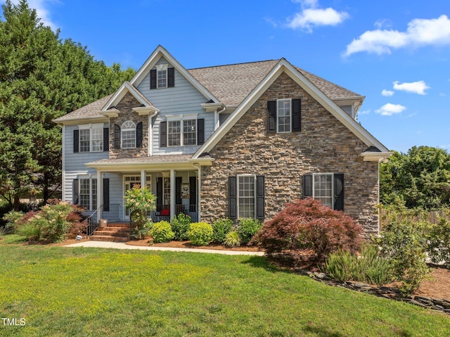 1420 Norwood Crest Ct, Raleigh, NC 27614 - view of front of house featuring a porch, stone siding, and a front lawn