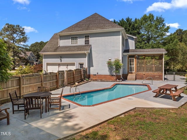 1420 Norwood Crest Ct, Raleigh, NC 27614 - view of swimming pool featuring a sunroom, a patio, and a fenced backyard