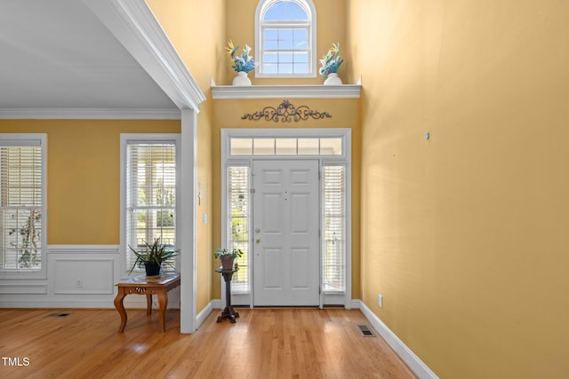 1420 Norwood Crest Ct, Raleigh, NC 27614 - foyer entrance featuring light wood finished floors, ornamental molding, and baseboards