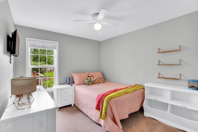 bedroom with a ceiling fan and light colored carpet