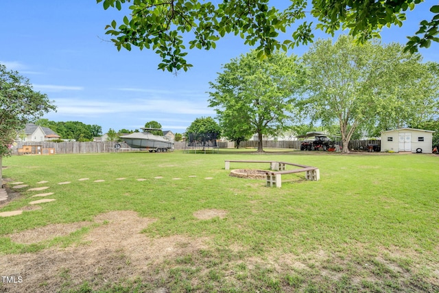 view of yard with fence and a carport