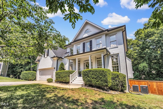1001 Dairy House Ct, Wake Forest, NC 27587 - view of front of house featuring covered porch, concrete driveway, and central air condition unit