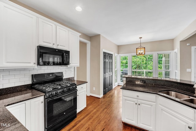 1001 Dairy House Ct, Wake Forest, NC 27587 - kitchen with black appliances, a sink, light wood-type flooring, backsplash, and white cabinetry