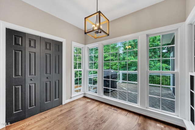 1001 Dairy House Ct, Wake Forest, NC 27587 - unfurnished sunroom featuring a chandelier