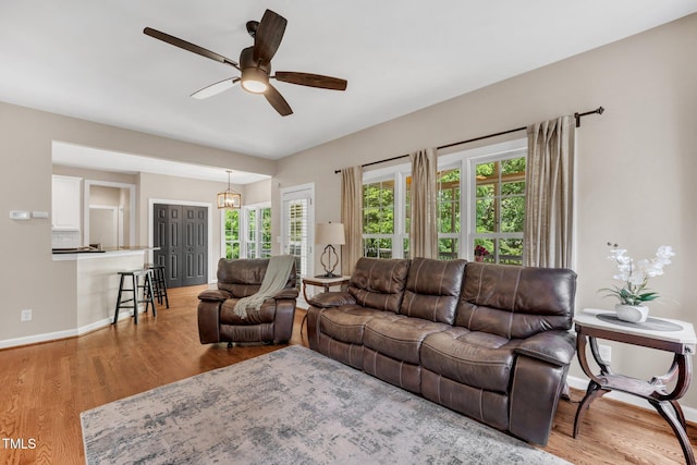 1001 Dairy House Ct, Wake Forest, NC 27587 - living area featuring ceiling fan, wood finished floors, plenty of natural light, and baseboards