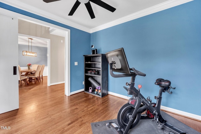 1001 Dairy House Ct, Wake Forest, NC 27587 - workout area featuring ceiling fan, wood finished floors, ornamental molding, a chandelier, and baseboards