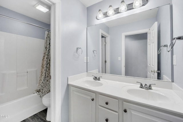 1001 Dairy House Ct, Wake Forest, NC 27587 - bathroom featuring toilet, double vanity, wood finished floors, and shower / bath combo with shower curtain