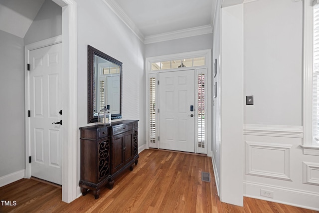 entrance foyer with a healthy amount of sunlight, light wood-style flooring, and visible vents