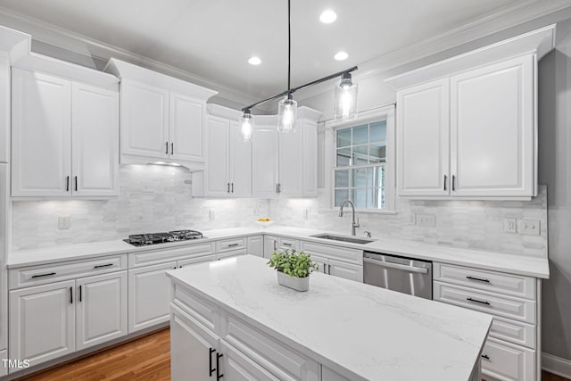 kitchen featuring white cabinets, light stone counters, gas cooktop, a sink, and dishwasher