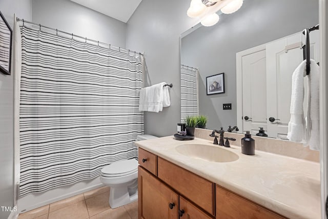 full bathroom featuring toilet, shower / tub combo with curtain, tile patterned flooring, and vanity