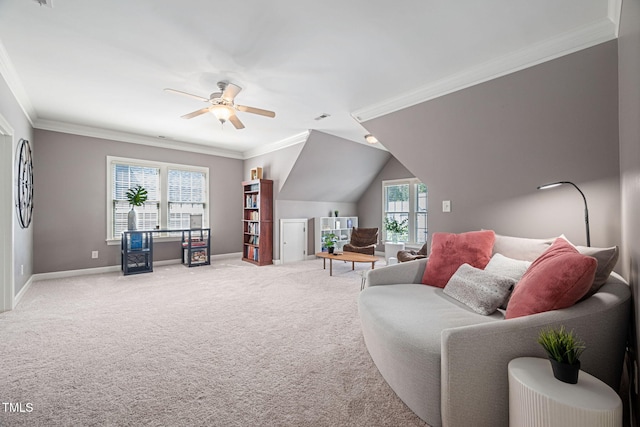 living area with carpet floors, ornamental molding, baseboards, and ceiling fan