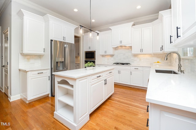2728 Cameron Pond Dr, Cary, NC 27519 - kitchen with a sink, white gas stovetop, stainless steel fridge with ice dispenser, a center island, and white cabinetry