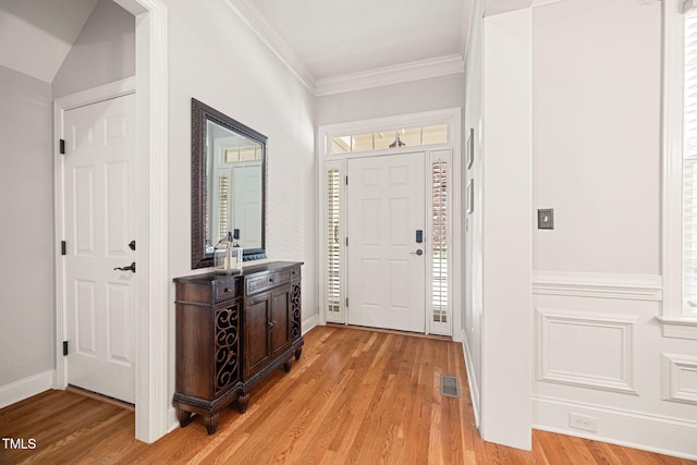 2728 Cameron Pond Dr, Cary, NC 27519 - entrance foyer featuring light wood-type flooring, healthy amount of natural light, and crown molding