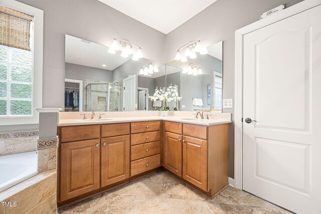 2728 Cameron Pond Dr, Cary, NC 27519 - full bathroom featuring a shower stall, double vanity, and a garden tub