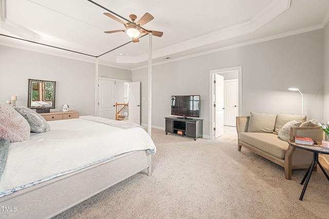 2728 Cameron Pond Dr, Cary, NC 27519 - bedroom with a raised ceiling, light carpet, crown molding, baseboards, and a ceiling fan