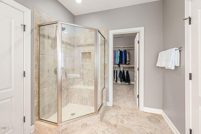 2728 Cameron Pond Dr, Cary, NC 27519 - full bath featuring a shower stall, a walk in closet, and baseboards