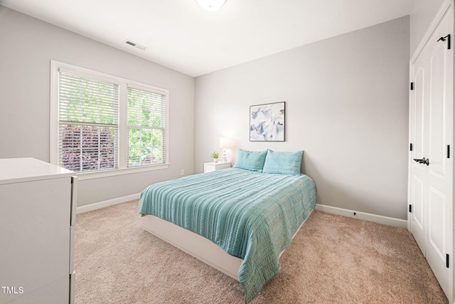 2728 Cameron Pond Dr, Cary, NC 27519 - bedroom featuring light carpet and baseboards