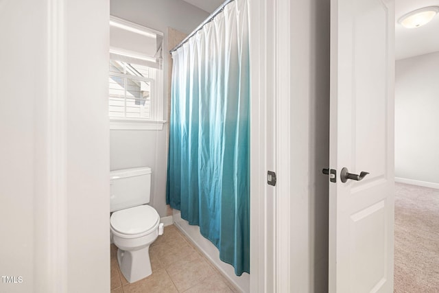 2728 Cameron Pond Dr, Cary, NC 27519 - bathroom with toilet, tile patterned flooring, curtained shower, and baseboards