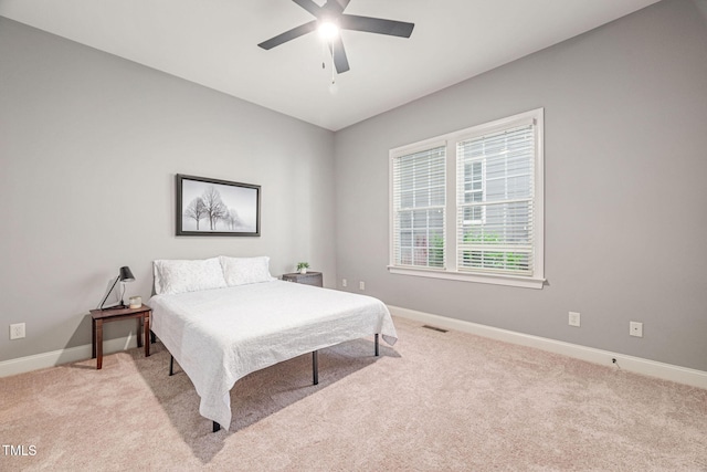 2728 Cameron Pond Dr, Cary, NC 27519 - bedroom with light carpet, baseboards, and ceiling fan