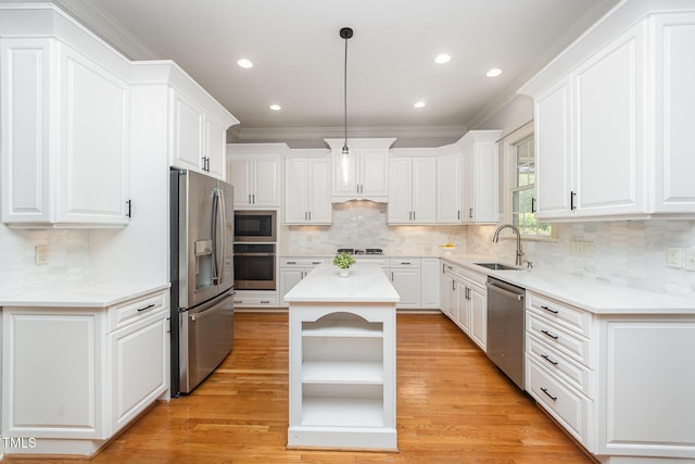 2728 Cameron Pond Dr, Cary, NC 27519 - kitchen with appliances with stainless steel finishes, open shelves, a sink, white cabinetry, and crown molding