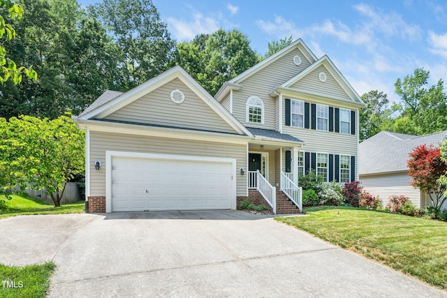 437 New Parkside Dr, Chapel Hill, NC 27516 - view of front facade featuring an attached garage, a front lawn, driveway, and brick siding