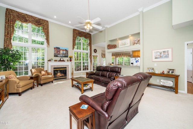 437 New Parkside Dr, Chapel Hill, NC 27516 - carpeted living area with crown molding, a towering ceiling, ceiling fan, and a fireplace