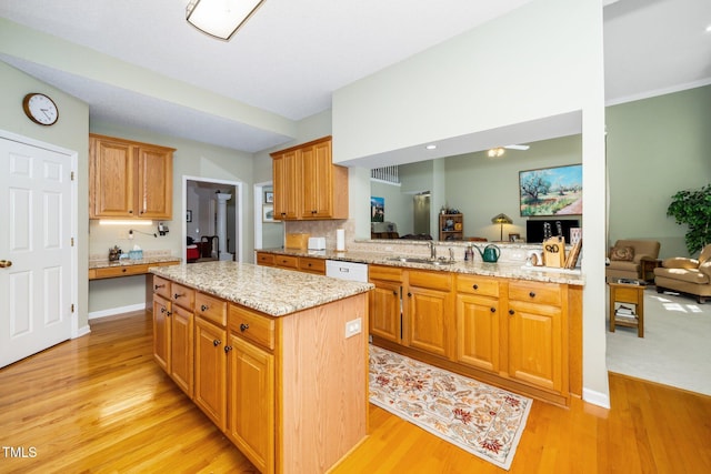 437 New Parkside Dr, Chapel Hill, NC 27516 - kitchen with a center island, a sink, and light wood finished floors