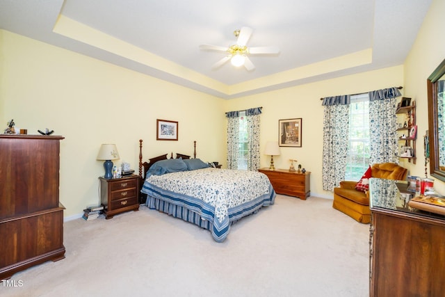 437 New Parkside Dr, Chapel Hill, NC 27516 - carpeted bedroom featuring a raised ceiling, baseboards, and ceiling fan