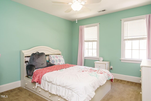 bedroom featuring baseboards, multiple windows, carpet flooring, and visible vents