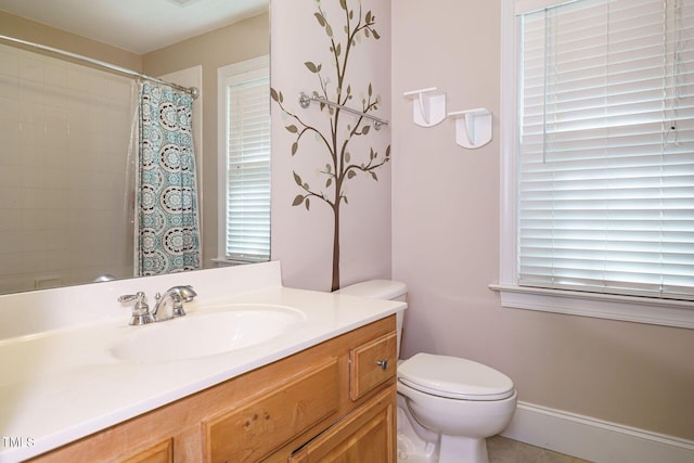 bathroom featuring vanity, toilet, and a shower with shower curtain