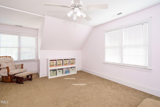 game room with carpet floors, baseboards, a ceiling fan, and visible vents