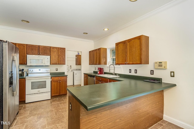 1176 Stoney Mountain Rd, Rougemont, NC 27572 - kitchen featuring stainless steel appliances, separate washer and dryer, ornamental molding, brown cabinets, and a peninsula