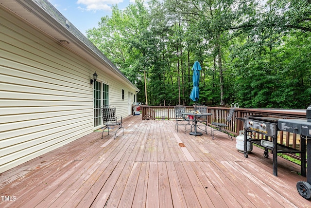 1176 Stoney Mountain Rd, Rougemont, NC 27572 - wooden terrace featuring outdoor dining area and view of wooded area