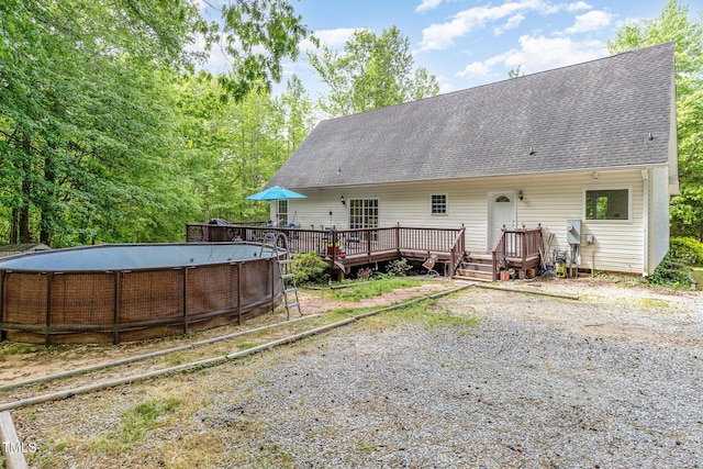 1176 Stoney Mountain Rd, Rougemont, NC 27572 - back of house featuring an empty pool, a wooden deck, and a shingled roof