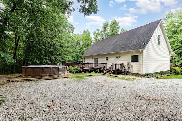 1176 Stoney Mountain Rd, Rougemont, NC 27572 - back of house featuring an outdoor pool, a deck, and a shingled roof