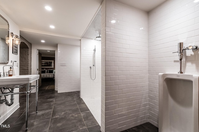 bathroom with recessed lighting and a walk in shower