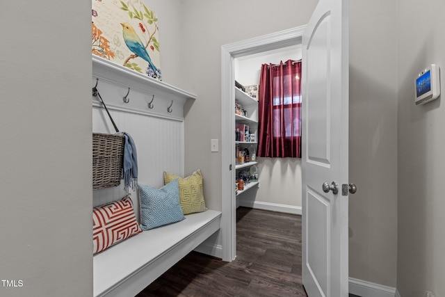mudroom with baseboards and dark wood-style floors