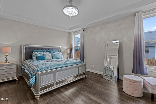 bedroom with baseboards, ornamental molding, and dark wood-type flooring