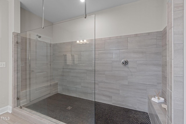 full bathroom with a walk in shower and tile patterned floors