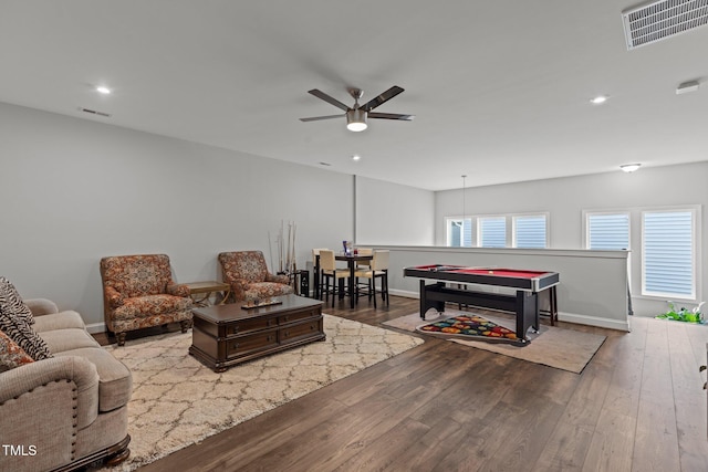 living room with ceiling fan, hardwood / wood-style floors, recessed lighting, baseboards, and visible vents